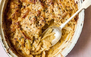 Fennel in a rustic gratin dish cooked with onions, creme fraiche and nutmeg