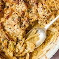 Fennel in a rustic gratin dish cooked with onions, creme fraiche and nutmeg