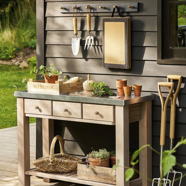 Potting table with garden accessories 