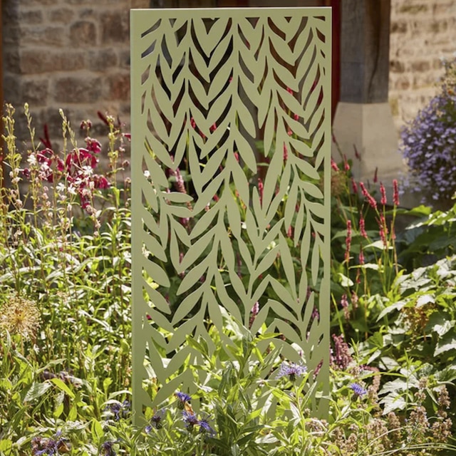 Decorative outdoor panel with green cut-out motif