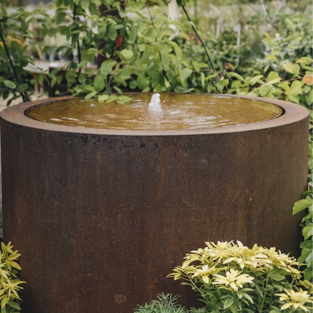 Circular drum-shaped  corten steel water feature 