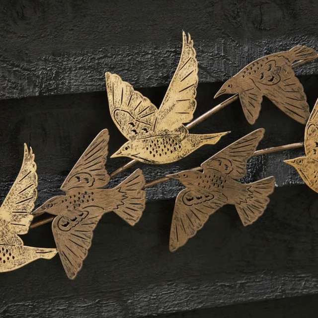 Brass metal cut outs of birds wall art