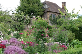 summer flowers in pink and red in cottage garden Sissinghurst England