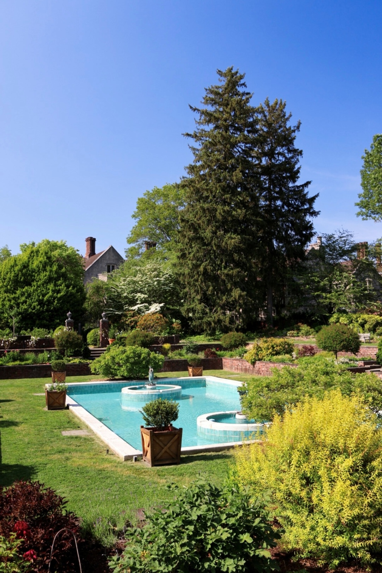 View of pool and water fountains at Planting Fields Arboretum in Oyster Bay, NY