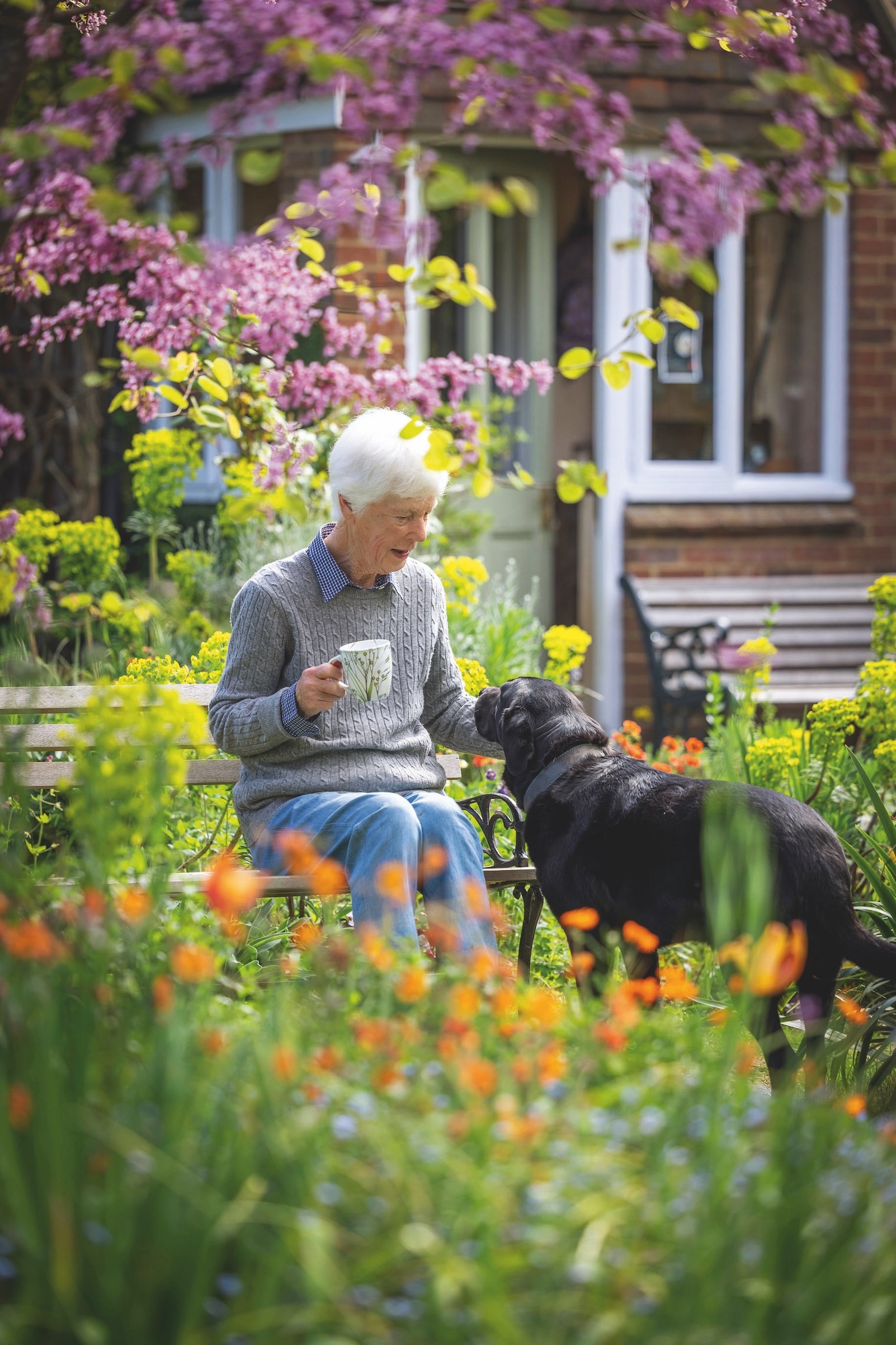 Sue Martin and her beloved black Labrador, Carson.