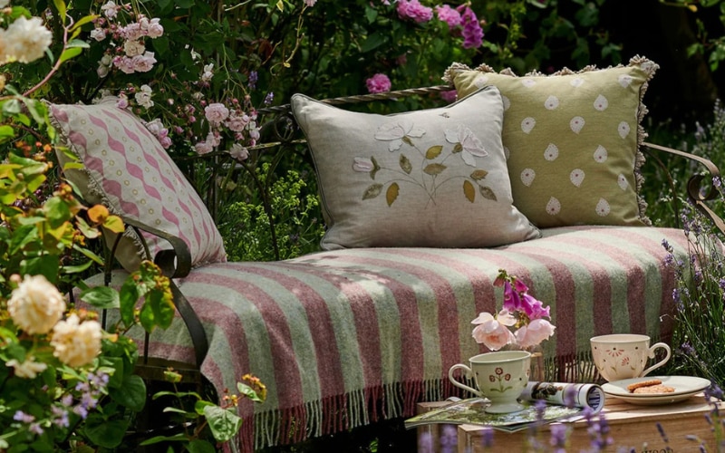 Susie Watson Designs cushions in a beautiful summer garden